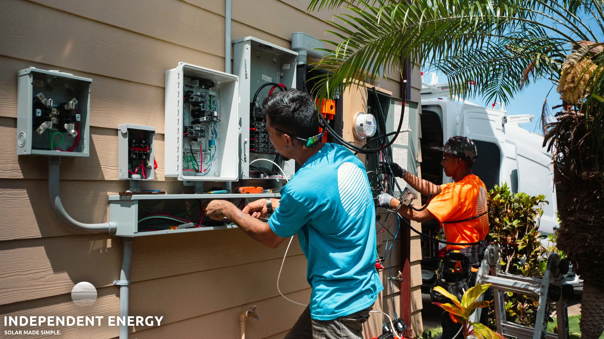 Independent Energy Hawaii technicians performing solar panel electrical repair on Oahu rooftop