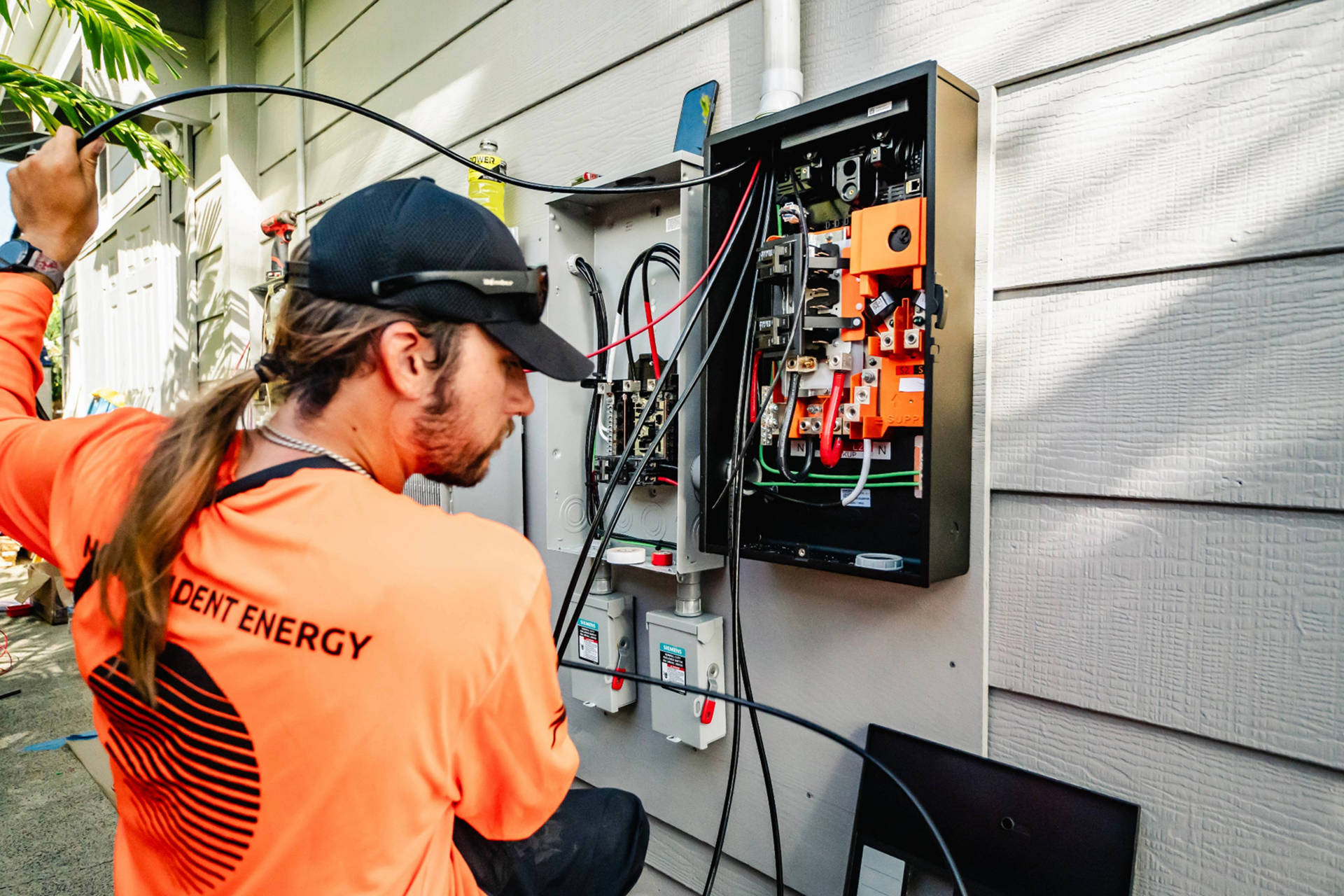 Solar technician repairing electrical system